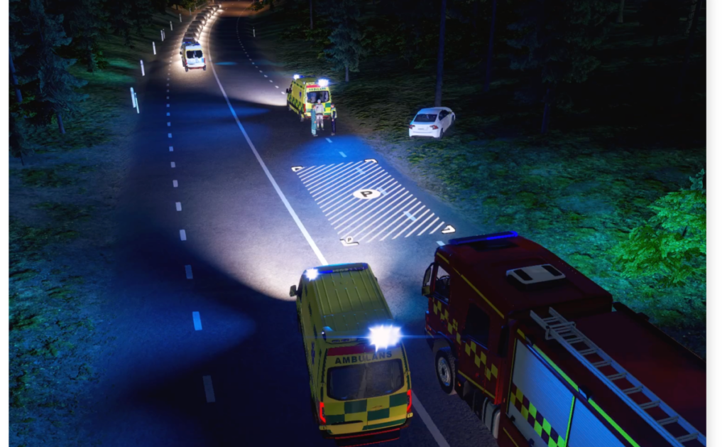 Illustrasjonsfoto fra VR-øving på skjerm, med ambulanse og brannbil på ulykkessted.